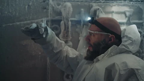 Scientist collecting samples. Researcher extracting specimens from cold Stock Footage 346522794