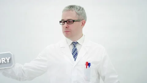 Scientist combines LABORATORY EQUIPMENT text on white background Stock Footage 137346098