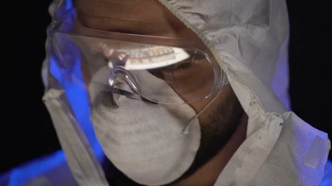 Scientist combining elements in test tube, manufacturing biological weapons Stock Footage 85069239