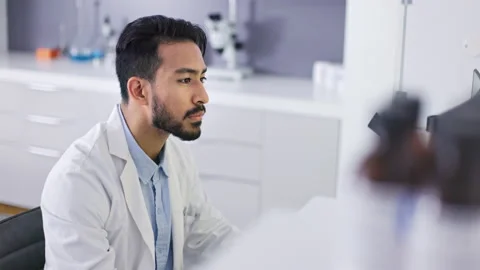 Scientist at computer, man is working wi... | Stock Video | Pond5