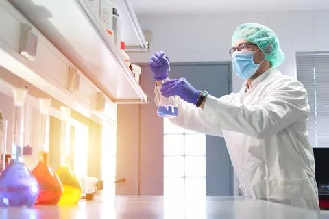 Scientist Conducting Experiment in Laboratory Setting Stock Photos