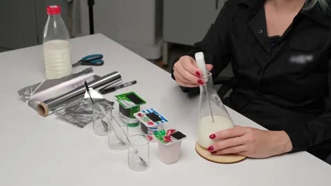 Scientist conducting milk analysis in laboratory Stock Footage 306322797