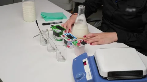 Scientist conducting milk analysis in laboratory Stock Footage 306323304
