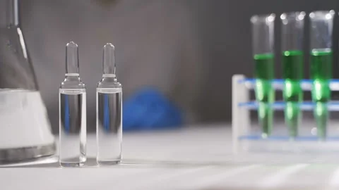 A scientist is conducting a study to create a vaccine for the new coronavirus Video stock 123543883