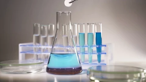 A scientist is conducting a study to create a vaccine for the new coronavirus Stock Footage 123543937