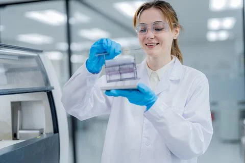 Scientist conducts experiment in laboratory while handling samples with car.. 스톡 사진