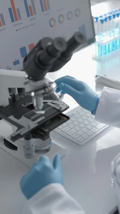 A scientist conducts research in a lab, analyzing data. Their expertise spans Stock Footage 280379464