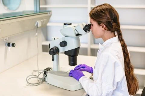 Scientist conducts study of biological material in lab Stock Photos