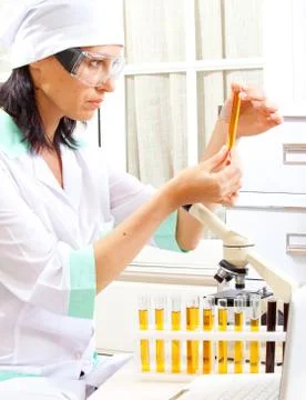 Scientist considering the sample tube Stock Photos