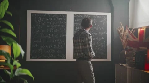 Scientist contemplates complex mathematical equations on a blackboard in his Video stock 314250153