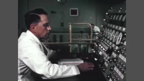 A scientist controls a nuclear explosion in a controlled nuclear reactor in the Stock Footage 88706720