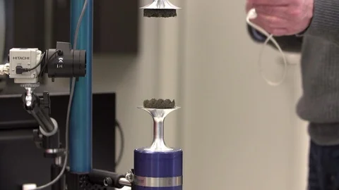 Scientist demonstrates acoustic levitator in lab Stock-Footage 93517523