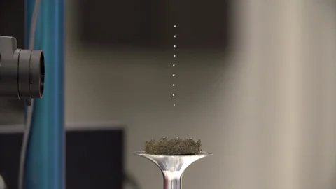 Scientist demonstrates acoustic levitator in lab Stock-Footage 93517599