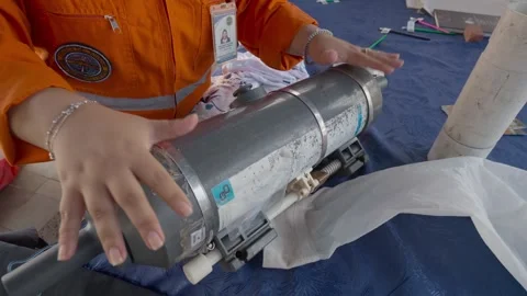 Scientist demonstrating Niskin bottle functioning Stock Footage 310007983