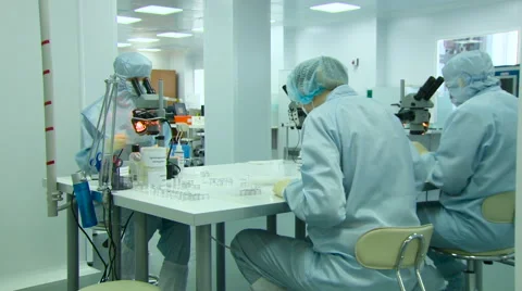 Scientist Doctor Sterilizes the Surface For Working With a Microscope in the Stock Footage 60999587