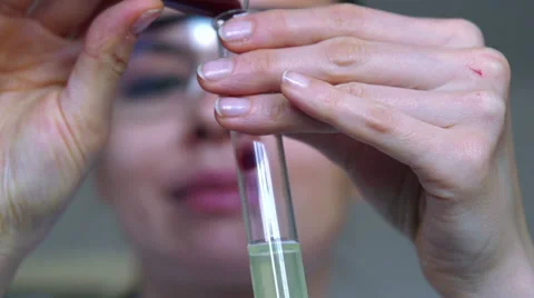 Scientist doing chemical experiment, super slow motion, shot at 240fps HD Stock Footage 36807318
