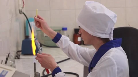 Scientist doing chemical test in microbiological lab. Warming up the instrument Stock-Footage 68077149
