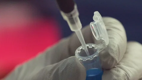 Scientist Draws DNA Lab Sample from Vial (Slow-Motion) Stock Footage 122862447