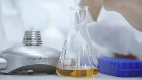 Scientist Drop and mix sollution laboratory close up 50fps Video stock 247403346