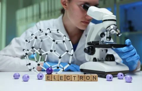 A Scientist Engaged in Observing Electron Microscopy While Utilizing a Molecular Stock Photos