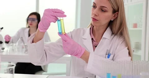 Scientist engaged in solution research or data analysis in laboratory Stock Footage 265942717