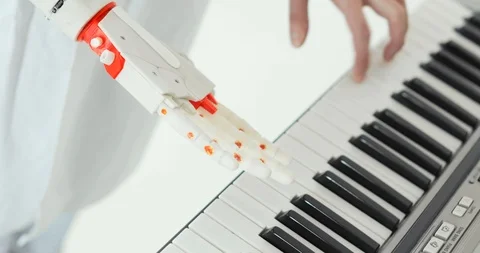 Scientist engineer is tasting robotic prosthesis hand playing the piano trying Vídeo Stock 106221145