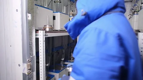 A scientist enters a refrigerator in a laboratory. The study of the soil Stock Footage 231740282