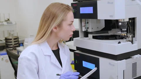 Scientist evaluating analytical results using precise measurement equipment in Stock Footage 343247038