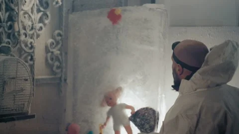 Scientist examines artifacts. Researcher observes frozen toys carefully Stock Footage 346474283