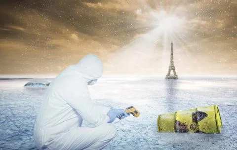 A scientist examines a barrel with rdioactive waste Stock Photos