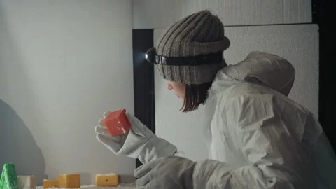 Scientist examining frozen sample carefully. Professional in protective attire Video stock 342743398