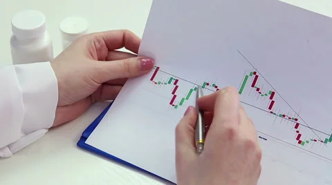 Scientist examining graph curves, conducting medical research, comparing data Stock Footage 60843702