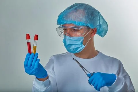 Scientist examining laboratory samples with test tubes Stock Photos