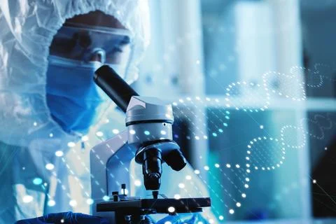 Scientist examining samples closely with microscope in laboratory setting Stock Photos