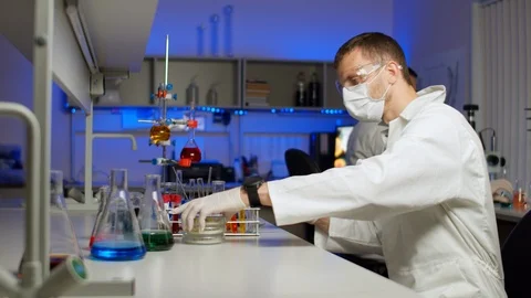 Scientist examining sprouts in Petri dish Stock-Footage 127563063