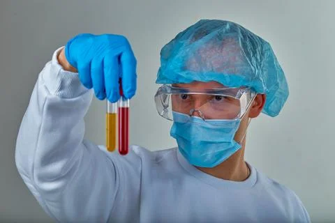 Scientist Examining Test Tubes in Laboratory Stock Photos
