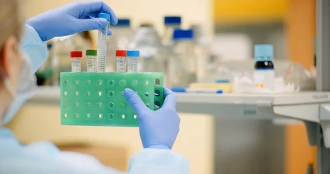 Scientist examining tubes at laboratory Stock-Footage 126253657