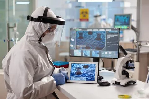 Scientist examining virus evolution using high tech technology researching Stock Photos