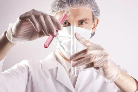 Scientist experimenting with colorfull fluids Stock Photos