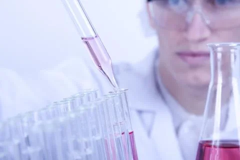 Scientist experimenting with colorfull fluids Stock Photos