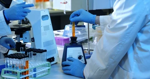 Scientist experimenting in laboratory 4k Stock Footage 95978066