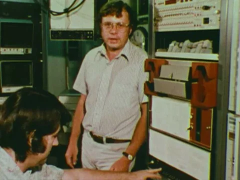 A scientist explains the functions of various electronics in the control room Stock Footage 74947731