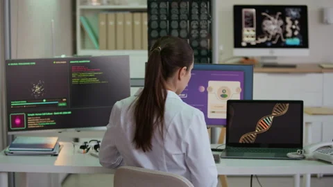 Scientist Exploring Human Cell Data with AI Software in Laboratory Stock Footage 332359638