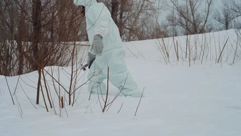Scientist exploring icy wasteland cautiously. Research specialist wearing 動画素材 342748623