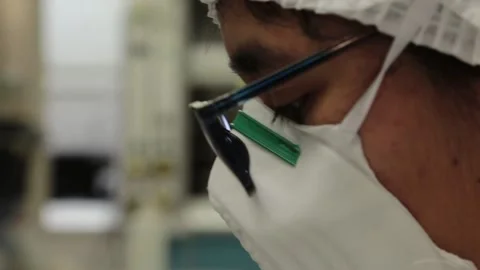 Scientist eyes, looking to a sample inside a lab Stock-Footage 155118598