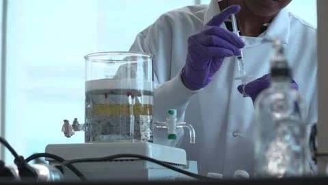 Scientist filling a test tube Stock Footage 106901752