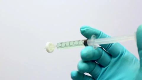 A scientist filters a sample solution with a microsyringe filter membrane Stock Footage 321971031