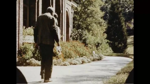 Scientist George Washington Carver checking plants at university campus - 1937 Stock Footage 104336009