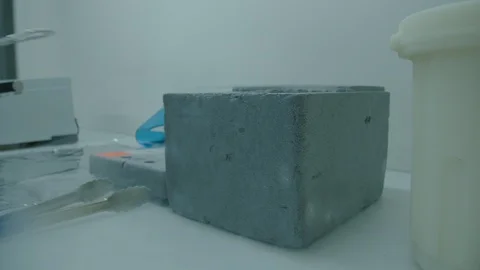 Scientist getting out an object from liquid azote container Video stock 104247065