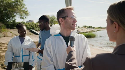 Scientist Giving Interview to Reporter About Ecological Disaster Stock Footage 344719610